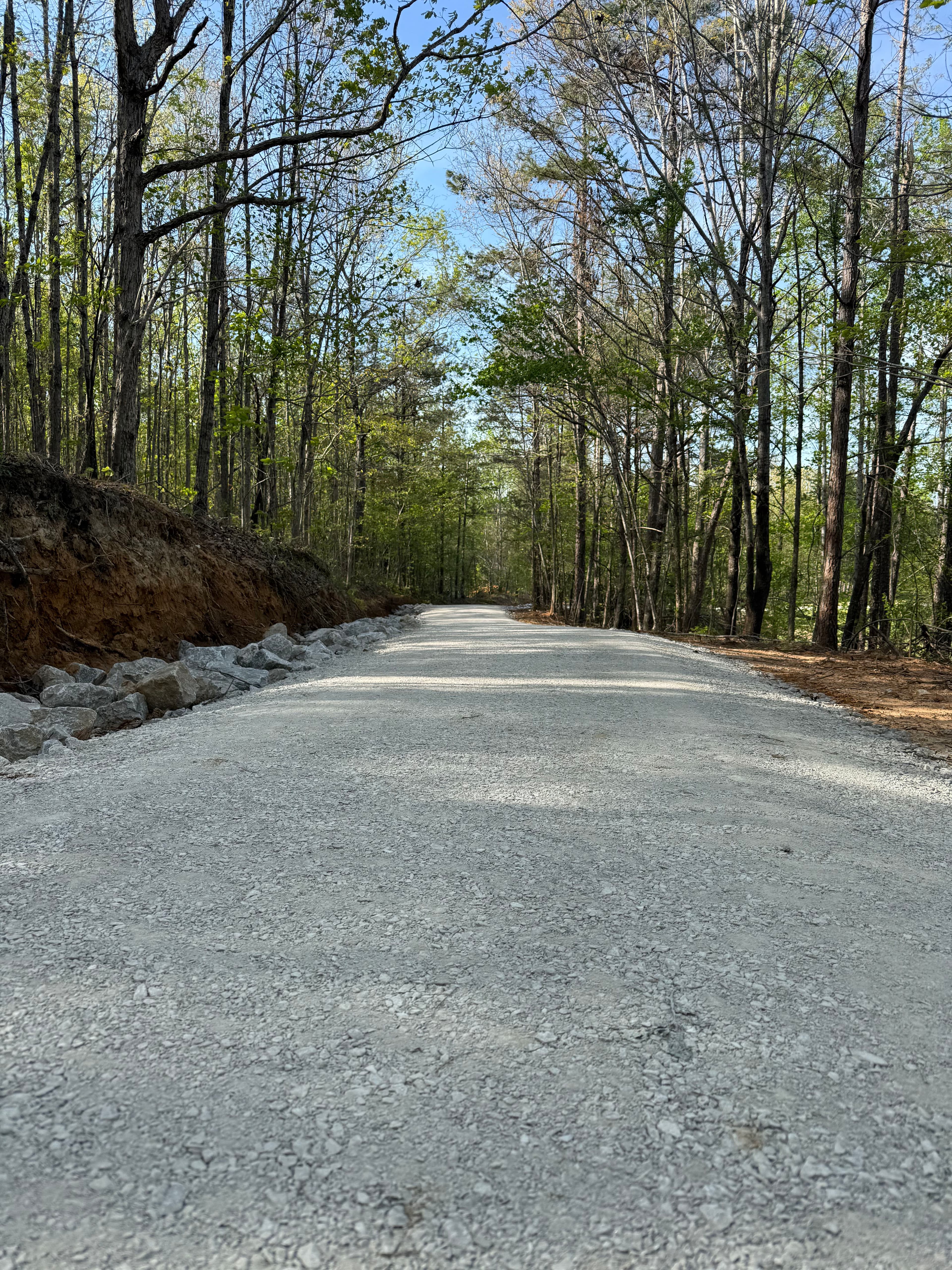 Project Gravel Driveway Cut Through Wooded Property and Ready to Build image